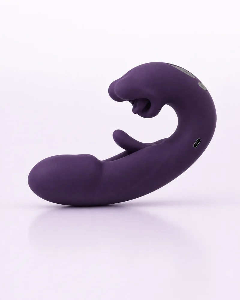 Red Lip vibrator i lila mot en ljus lila bakgrund